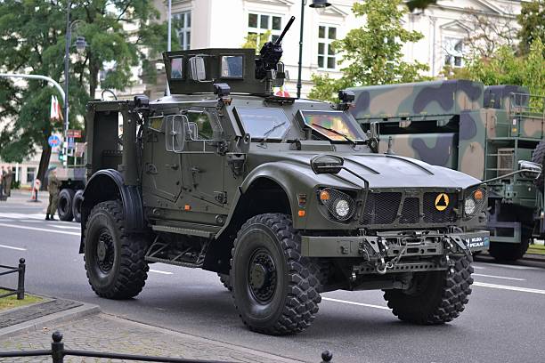 Warsaw, Poland, 15th August 2016: The military truck Oshkosh M-ATV "MRAP" stopped on the street before the parade on the Polish Armed Forces Day. The Oshkosh is an American tactical vehicles manufacturer. Presented truck is 2-axle, all-wheel-drive (4x4), high-mobility special vehicle. This exemplar was used during the missions in Afghanistan.